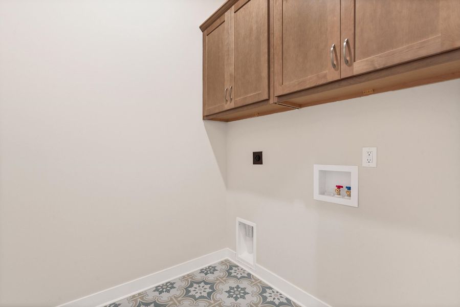 Laundry room with cabinet space, washer hookup, and electric dryer hookup