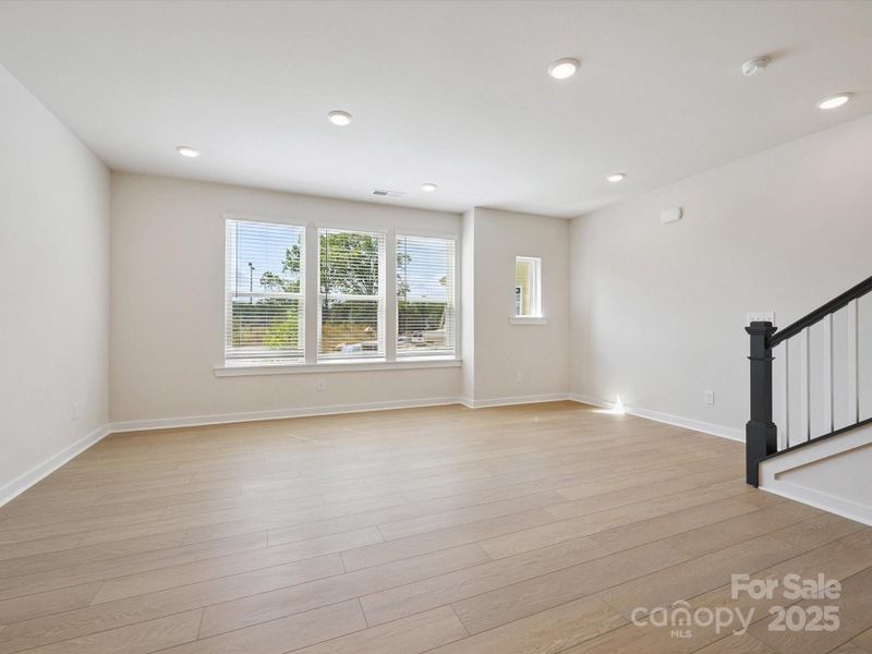 Spacious, unfurnished interior of a new home in Central Living at Craig, Charlotte (Image 30).