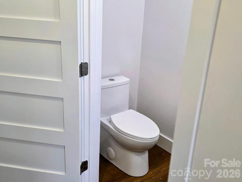 Half bath off of hallway to the laundry