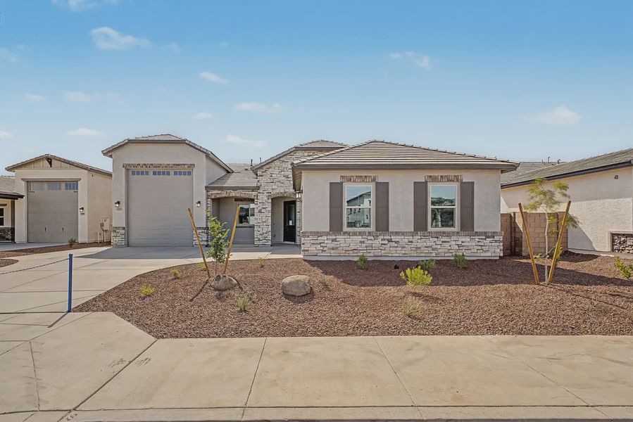 Front exterior of a new home in Valencia at Granite Vista, Waddell, AZ, highlighting curb appeal (Image 2). Front exterior of a new home in Valencia at Granite Vista, Waddell, AZ, highlighting curb appeal (Image 2).
