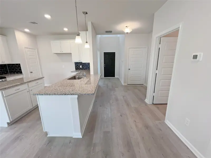 The Georgetown II- Kitchen and Foyer. Sample image for illustration; upgrades, options, and colors may vary.