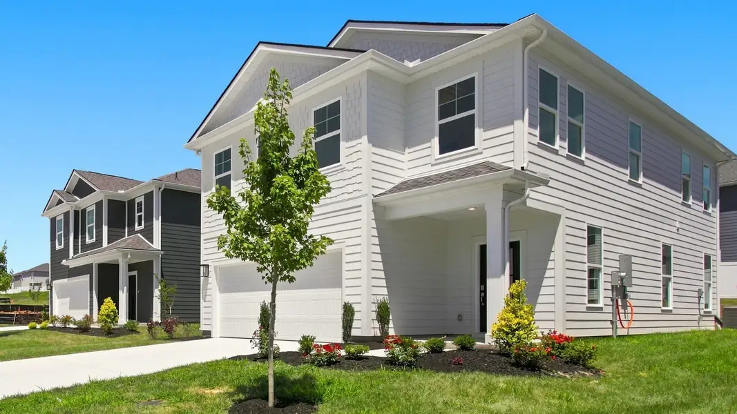 Angled view of two-story home focused on porch side Angled view of two-story home focused on porch side