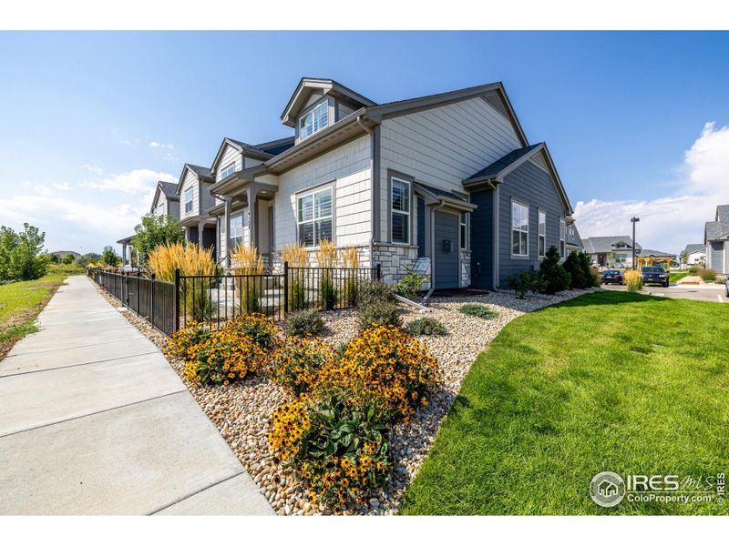 Front exterior of a new home in , Loveland, CO, highlighting curb appeal (Image 24).
