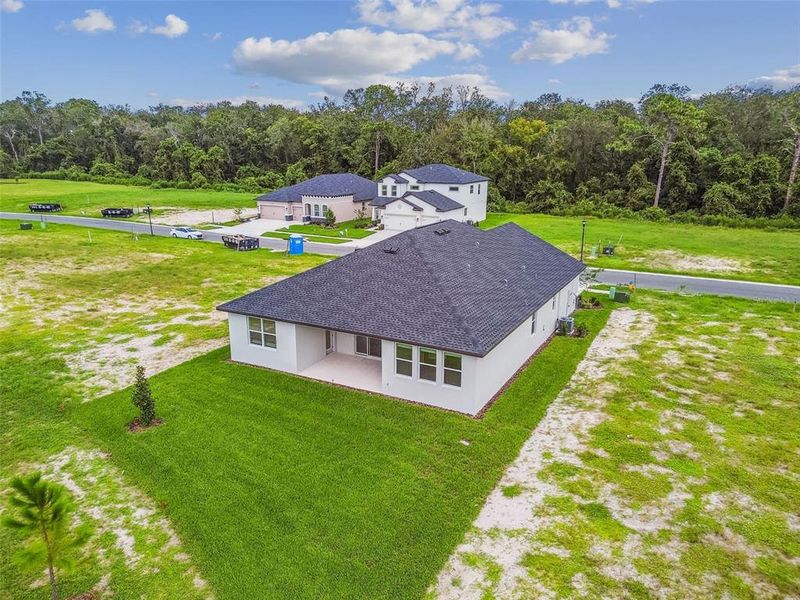 Front exterior of a new home in Hidden Ridge, New Port Richey, FL, highlighting curb appeal (Image 30). Front exterior of a new home in Hidden Ridge, New Port Richey, FL, highlighting curb appeal (Image 30).