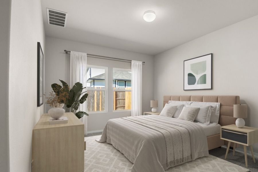 Image of a staged primary bedroom with a tan bed frame, white bedding, a light wooden dresser, and side tables with lamps