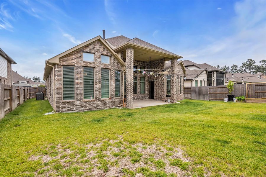 Exterior details and patio area of a home in , Conroe (Image 4).