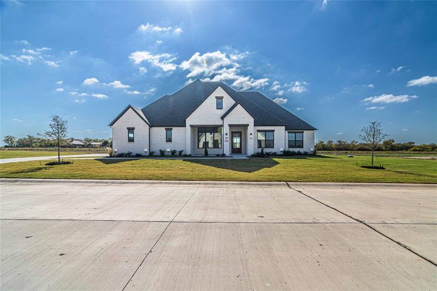 Front exterior of a new home in , Caddo Mills, TX, highlighting curb appeal (Image 23).