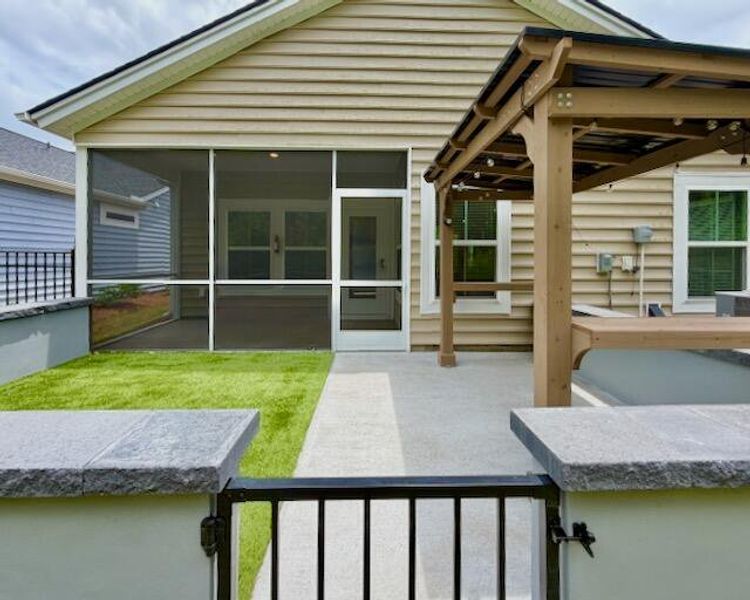 Exterior details and patio area of a home in Horizons at Summers Corner | 55+, Summerville (Image 22).