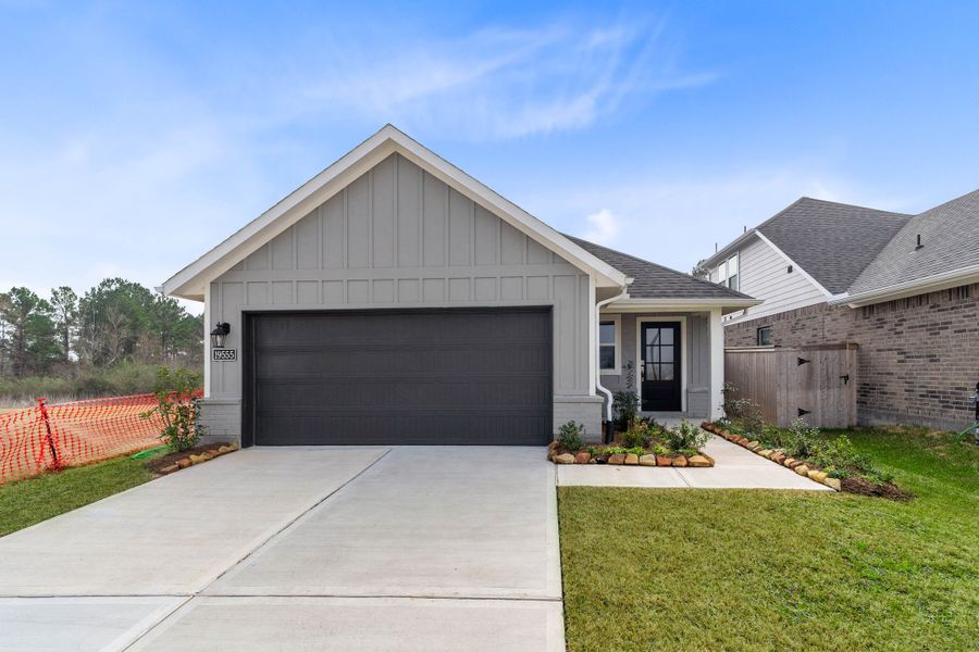 Front exterior of a new home in Montgomery Ridge, Montgomery, TX, highlighting curb appeal (Image 1). Front exterior of a new home in Montgomery Ridge, Montgomery, TX, highlighting curb appeal (Image 1).