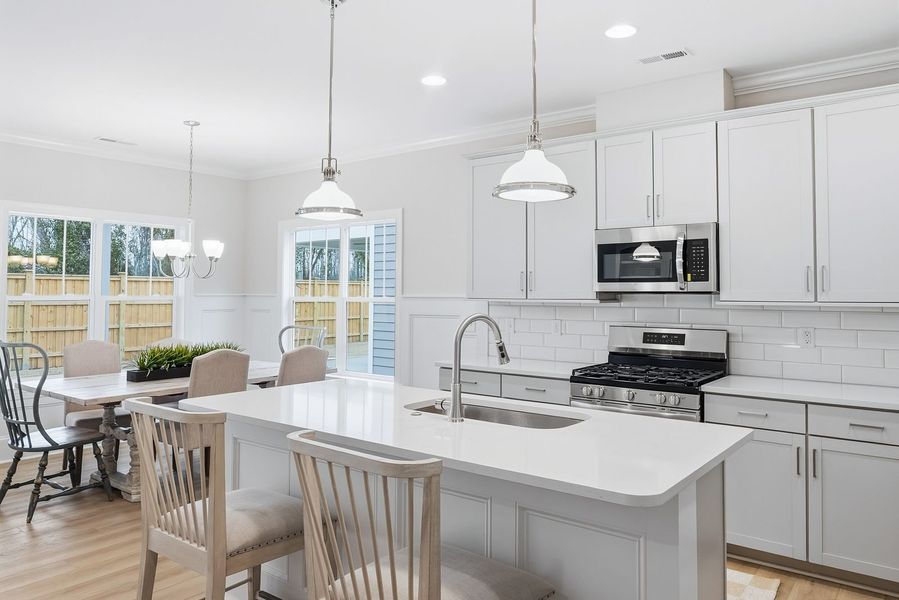 Representative furnished interior of a home built from the Kauai by Bill Clark Homes in The Sanctuary at Sunset Beach, Sunset Beach (Image 12).