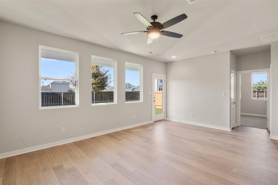 Unfurnished room featuring light wood-style floors, a ceiling fan, and recessed lighting