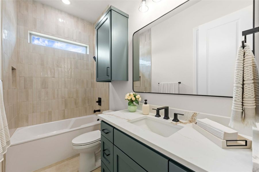 Crisp white bath with integrated tub and sleek vanity featuring a wide basin sink. Crisp white bath with integrated tub and sleek vanity featuring a wide basin sink.