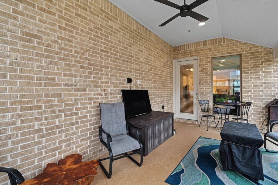 Covered back porch with seating space Covered back porch with seating space