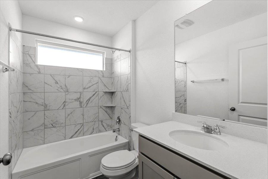 Bathroom with vanity and  shower combination