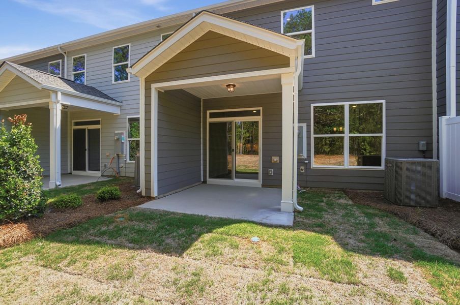 Exterior details and patio area of a home in Blythe Mill Townhomes, Waxhaw (Image 19).