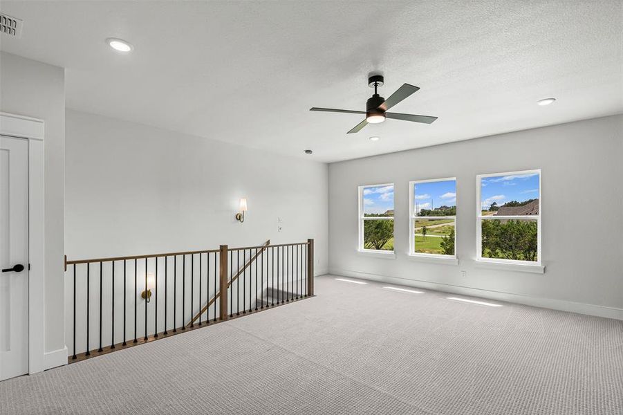 Carpeted spare room featuring recessed lighting and ceiling fan Carpeted spare room featuring recessed lighting and ceiling fan