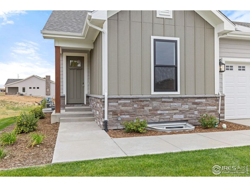 Exterior details and patio area of a home in Cottages at Kelly Farm, Greeley (Image 25).