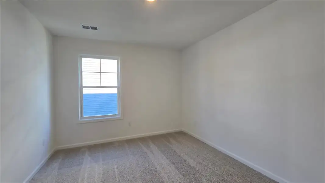 Soft carpeting pairs with neutral walls and a clas