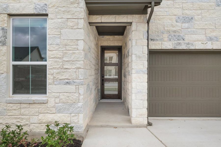 Exterior details and patio area of a home in Arbor Collection at Heritage, Dripping Springs (Image 3).