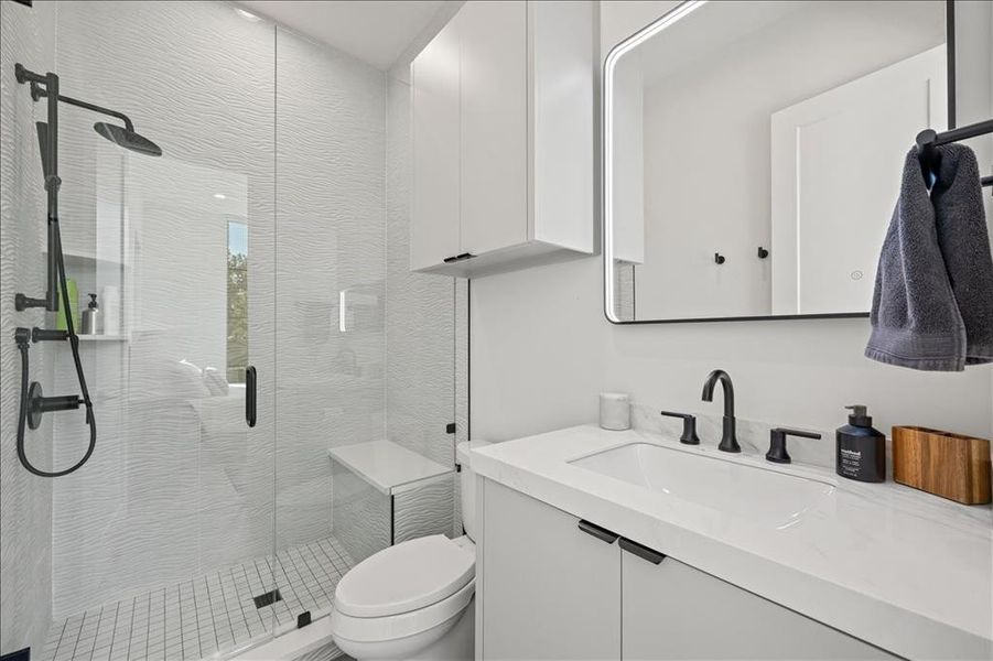 3rd bedroom bathroom featuring vanity and a stall shower