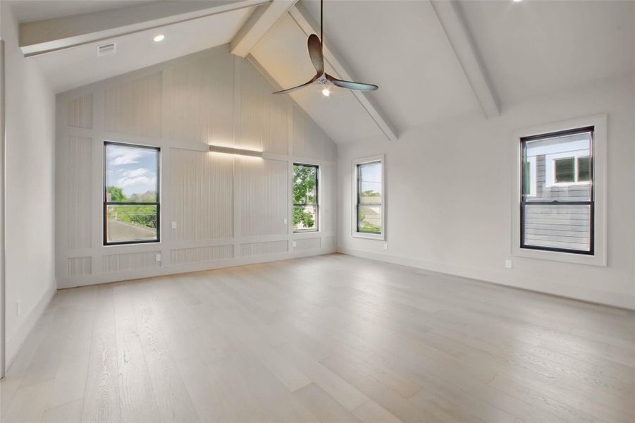 Sample of builder's previous construction. This home will have an upstairs primary suite same as pictured here with a vaulted beamed ceiling.