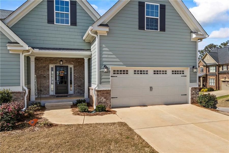 Front exterior of a new home in Traditions of Braselton, Jefferson, GA, highlighting curb appeal (Image 23). Front exterior of a new home in Traditions of Braselton, Jefferson, GA, highlighting curb appeal (Image 23).