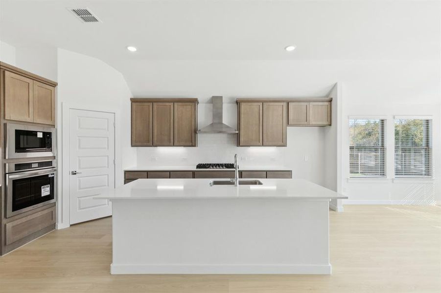 Kitchen in the Gilmour II home plan by Trophy Signature Homes – REPRESENTATIVE PHOTO Kitchen in the Gilmour II home plan by Trophy Signature Homes – REPRESENTATIVE PHOTO