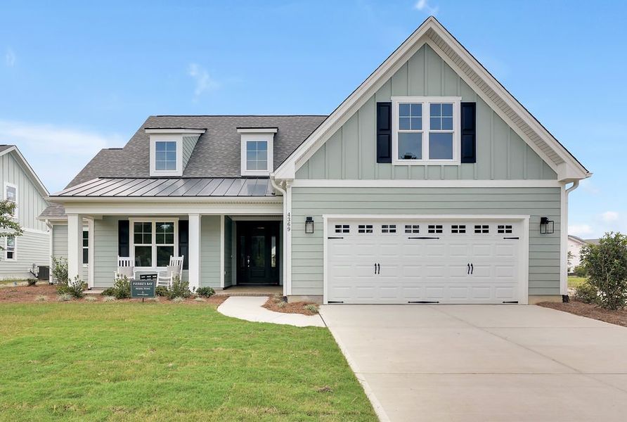 Front exterior of a new home in Brunswick Forest, Leland, NC, highlighting curb appeal (Image 1). Front exterior of a new home in Brunswick Forest, Leland, NC, highlighting curb appeal (Image 1).