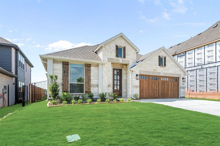 Front exterior of a new home in Parks of Aledo, Aledo, TX, highlighting curb appeal (Image 2). Front exterior of a new home in Parks of Aledo, Aledo, TX, highlighting curb appeal (Image 2).