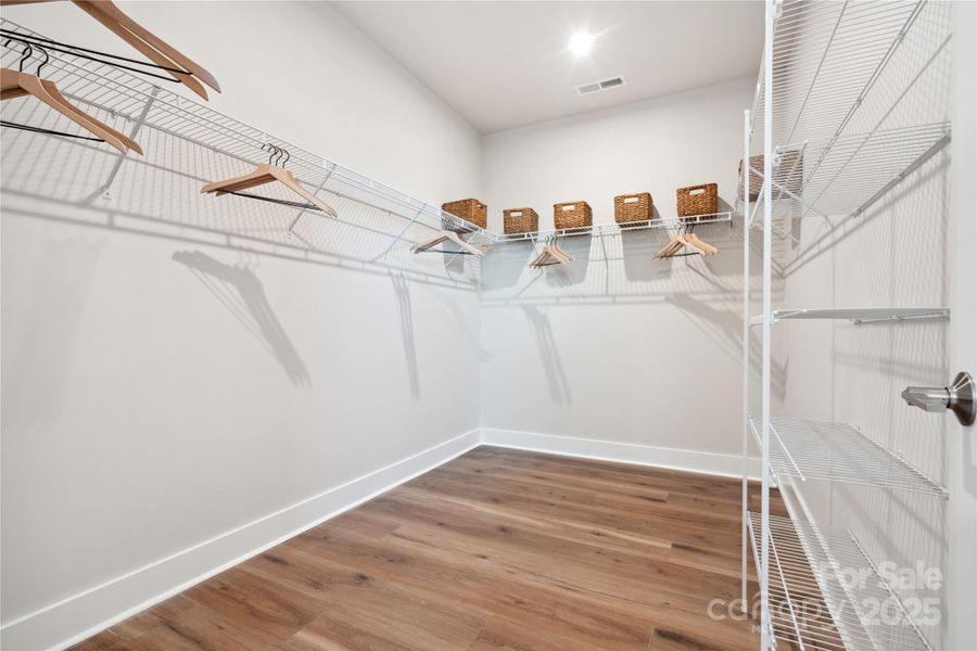 Oversized Primary Walk-In Closet. *Model Photos | Actual Finishes, Structural Selections, and Orientation May Vary.