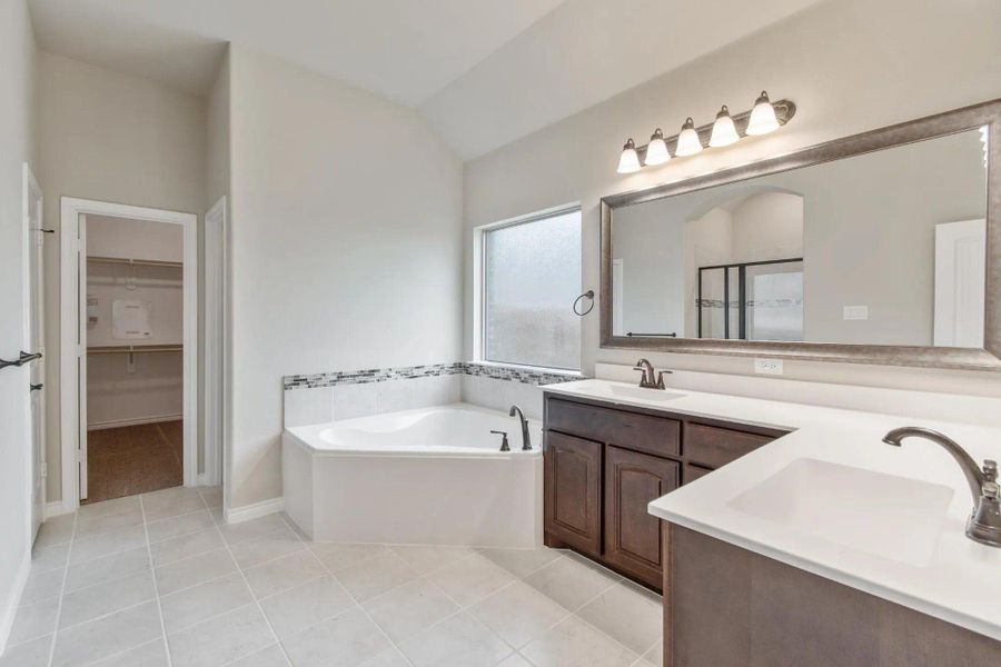 Primary Bathroom | Concept 2671 at Mockingbird Hills in Joshua, TX by Landsea Homes