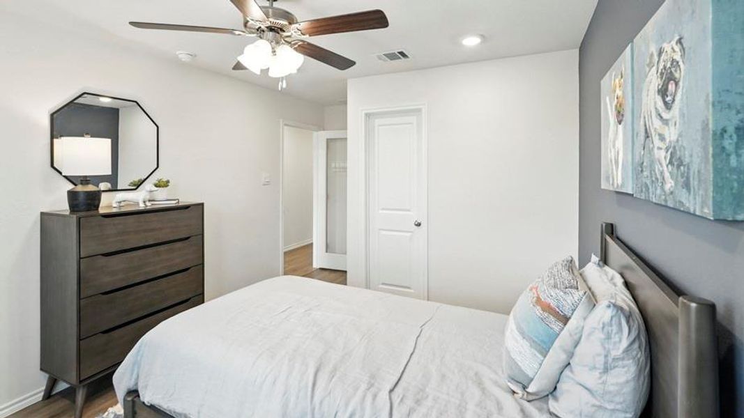 Bedroom featuring ceiling fan, recessed lighting, and dark wood-style floors Bedroom featuring ceiling fan, recessed lighting, and dark wood-style floors