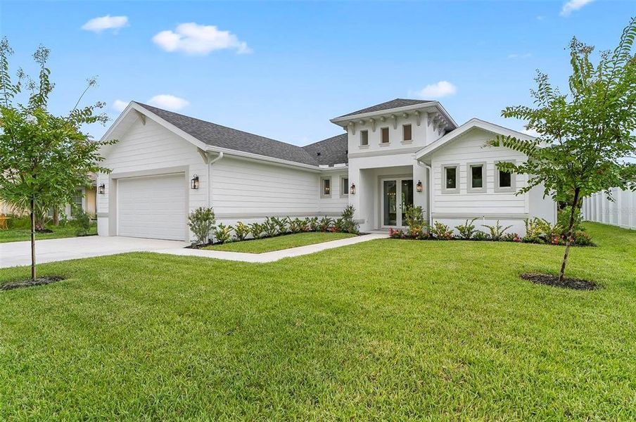 Front exterior of a new home in , Palm Coast, FL, highlighting curb appeal (Image 26).