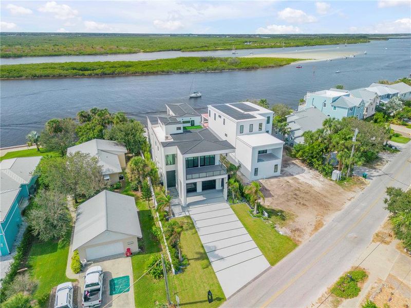 Front exterior of a new home in , New Smyrna Beach, FL, highlighting curb appeal (Image 21). Front exterior of a new home in , New Smyrna Beach, FL, highlighting curb appeal (Image 21).