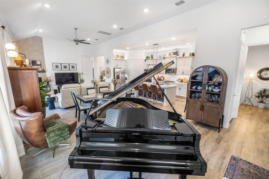 Workout room with light wood-style floors, recessed lighting, and ceiling fan Workout room with light wood-style floors, recessed lighting, and ceiling fan