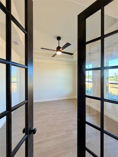 Unfurnished sunroom featuring french doors Unfurnished sunroom featuring french doors