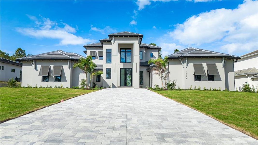 Front exterior of a new home in , Montverde, FL, highlighting curb appeal (Image 29). Front exterior of a new home in , Montverde, FL, highlighting curb appeal (Image 29).