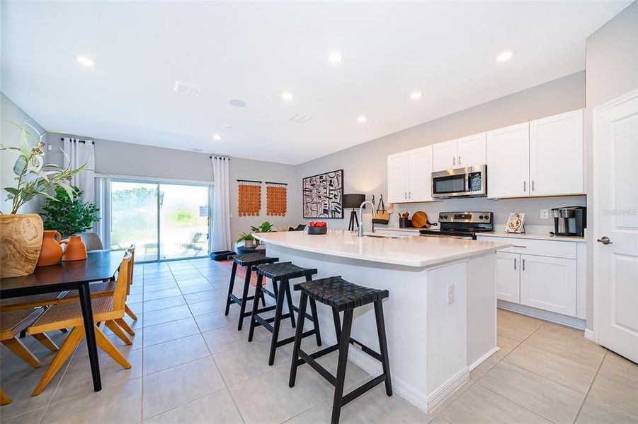 Furnished interior view inside a new home in Horse Creek at Crosswinds, Davenport (Image 6).