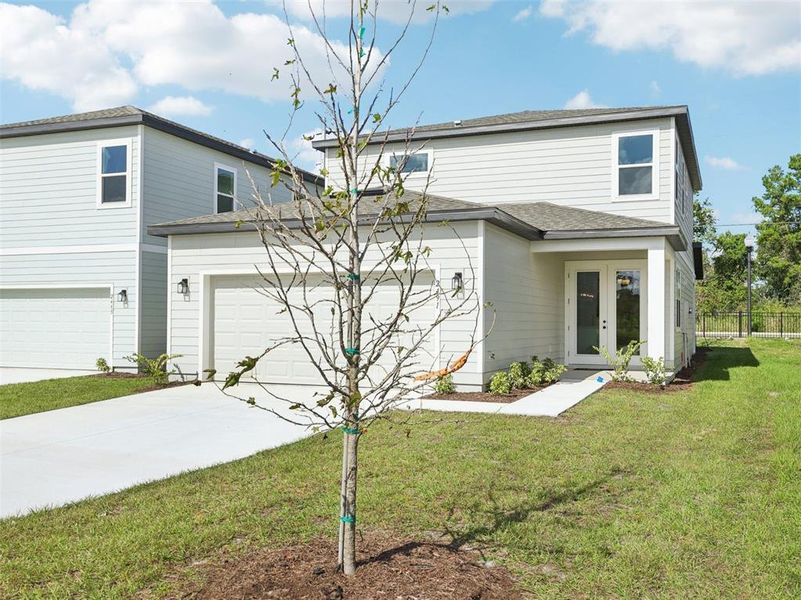 Front exterior of a home in the Ellington Classical community, located in St. Cloud, FL (Image 2).