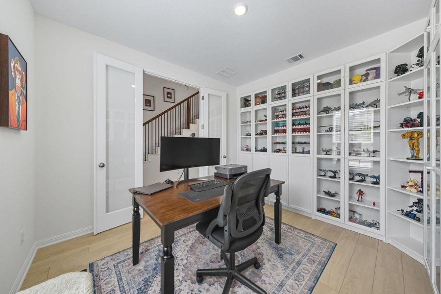 Home office featuring light wood-style flooring and baseboards Home office featuring light wood-style flooring and baseboards