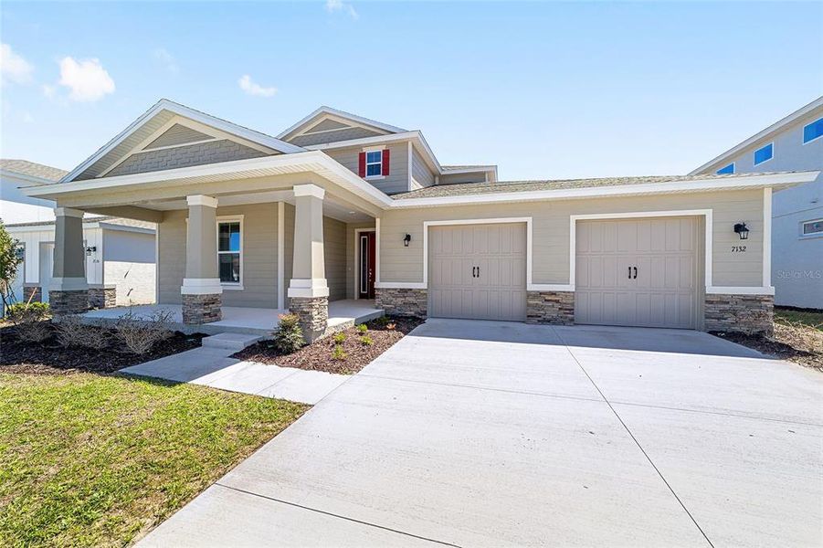 Front exterior of a new home in Calesa Township, Ocala, FL, highlighting curb appeal (Image 22).