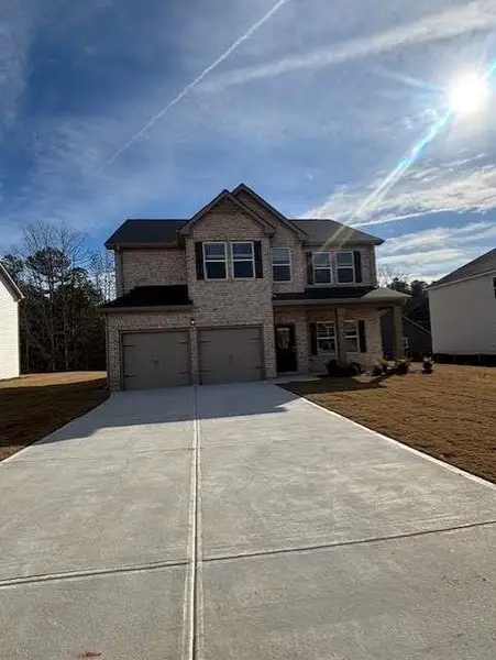 Front exterior of a new home in , Fairburn, GA, highlighting curb appeal (Image 1). Front exterior of a new home in , Fairburn, GA, highlighting curb appeal (Image 1).
