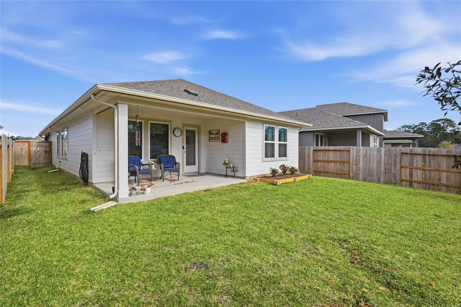 The attractive and well manicured back yard offers plenty of space for the kids and pets to run and play.