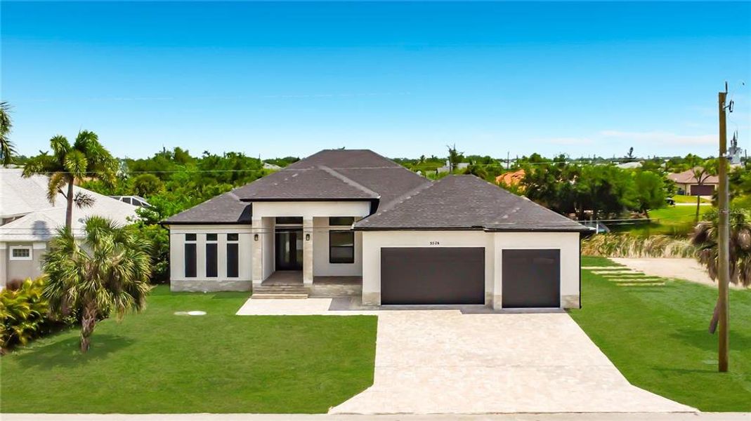 Front exterior of a new home in , Port Charlotte, FL, highlighting curb appeal (Image 22).