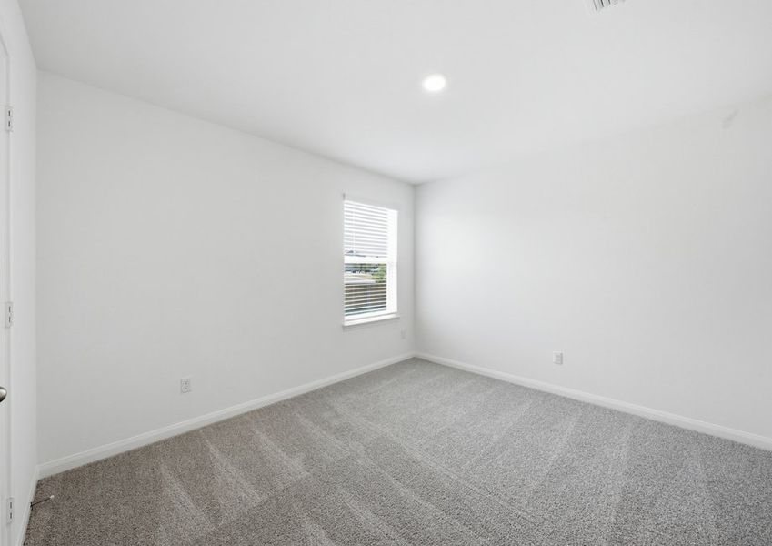 Carpeted Bedroom 3 featuring a window with natural light. Carpeted Bedroom 3 featuring a window with natural light.
