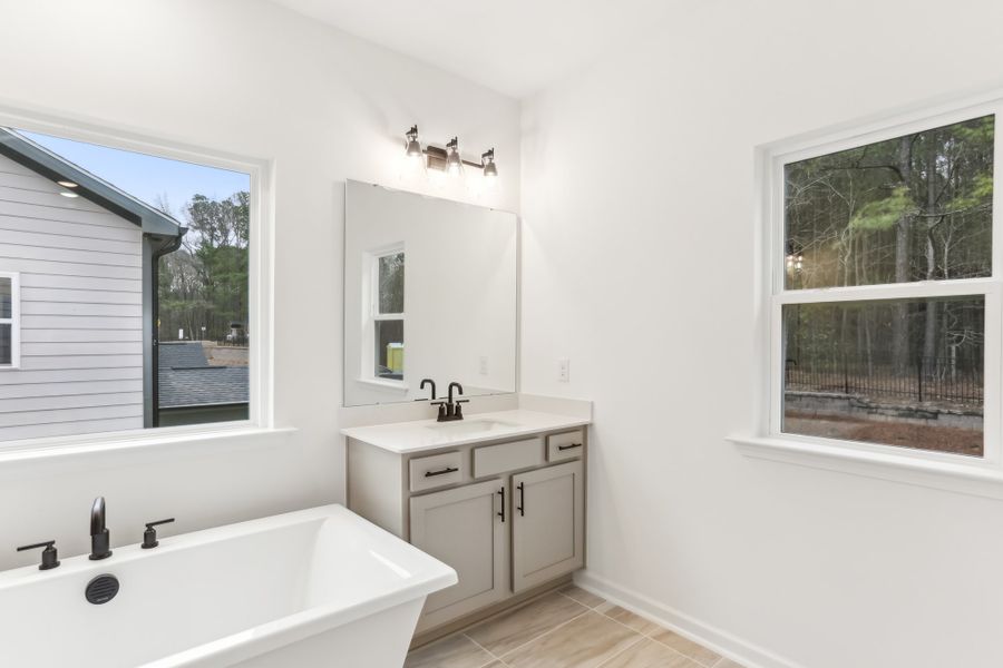 Representative furnished interior of a home built from the Alexis by Ashton Woods in Rowland's Grant, Fuquay Varina (Image 27).