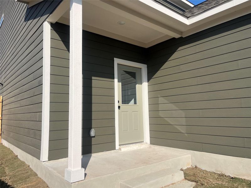 Exterior details and patio area of a home in The Cottages at Lariat, Liberty Hill (Image 23).