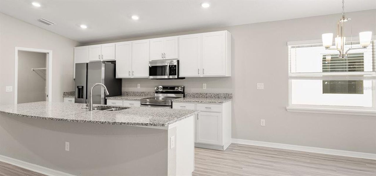 Furnished interior view inside a new home in Bennah Oaks, Belleview (Image 4).