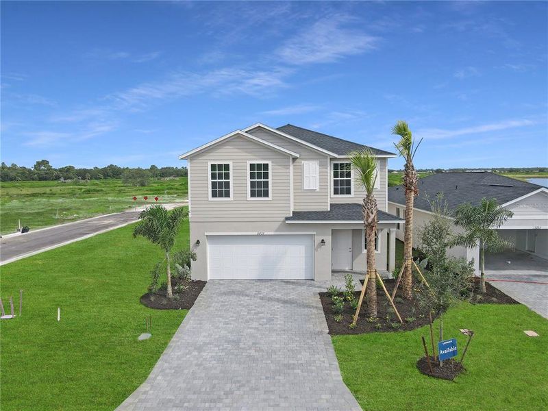 Front exterior of a home in the Lennar at Turnleaf: Americana Series community, located in Punta Gorda, FL (Image 8).