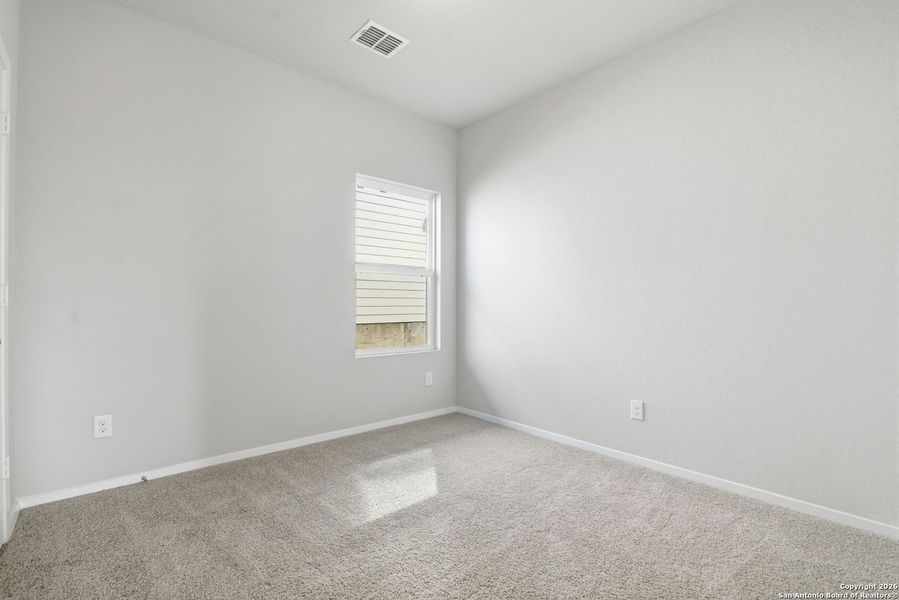 Spacious, unfurnished interior of a new home in Hunters Ranch, San Antonio (Image 39).